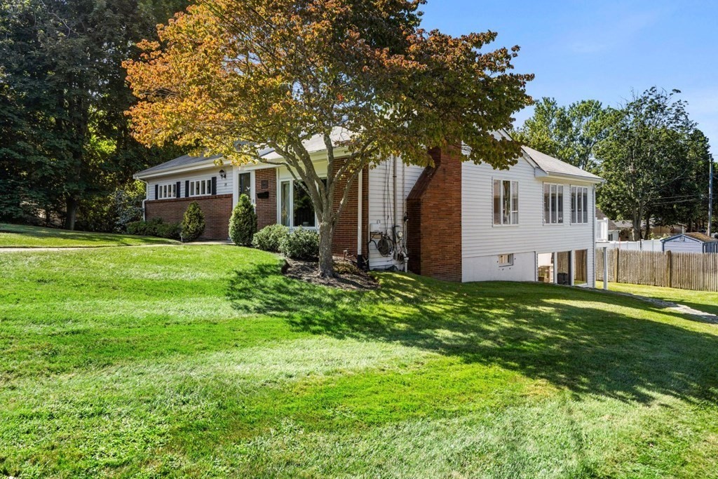 14 Highview Drive Hingham, MA 02043 - Photo 4 of 41 a front view of a house with a garden