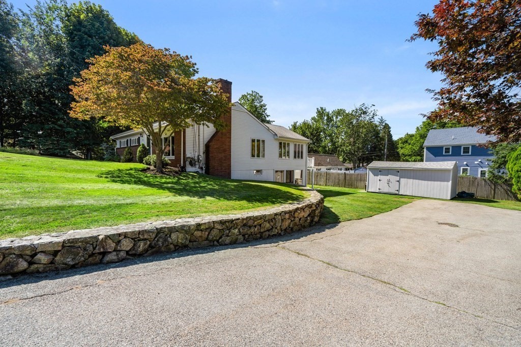 14 Highview Drive Hingham, MA 02043 - Photo 5 of 41 a front view of a house with a yard and garage