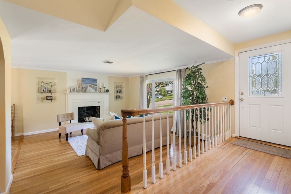 14 Highview Drive Hingham, MA 02043 - Photo 6 of 41 a living room with furniture a fireplace and a window