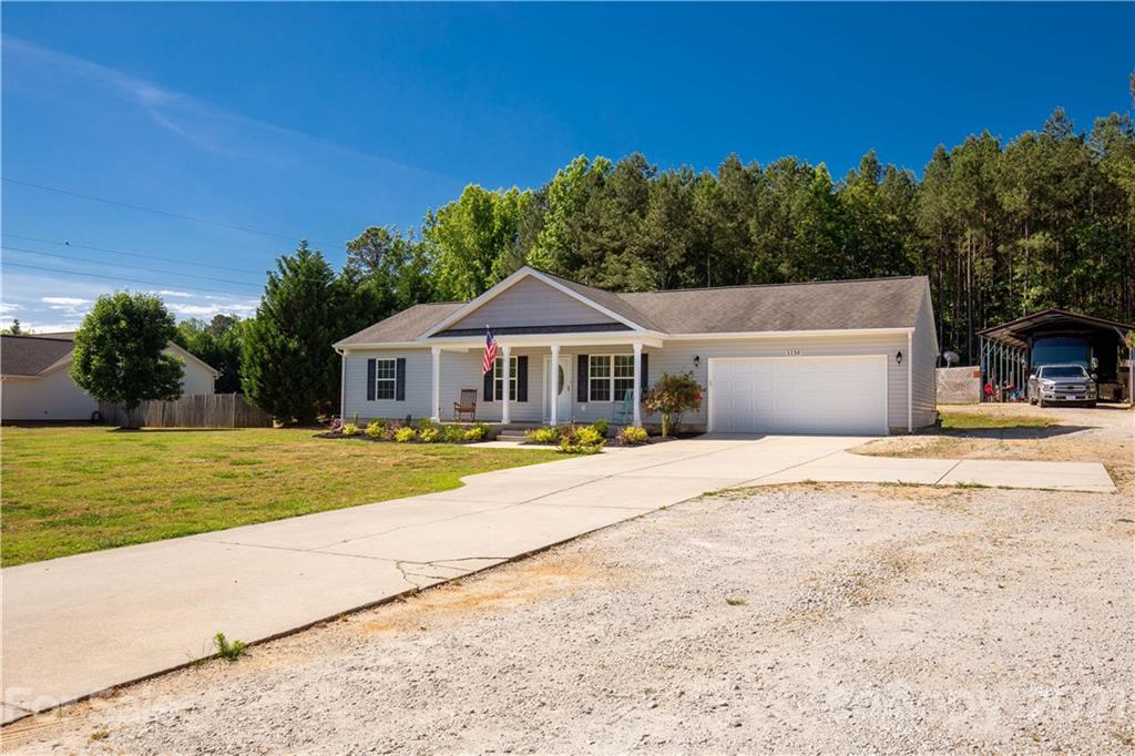 5150 Taxahaw Road Lancaster, SC 29720 - Photo 2 of 27 a front view of a house with garden