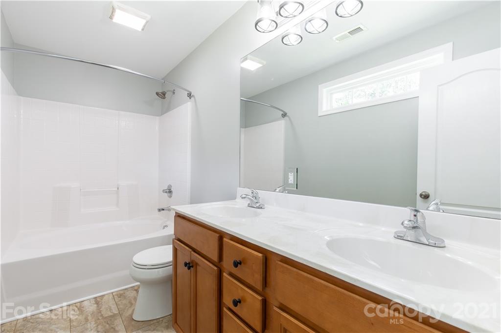 5150 Taxahaw Road Lancaster, SC 29720 - Photo 22 of 27 a bathroom with a sink a toilet and shower