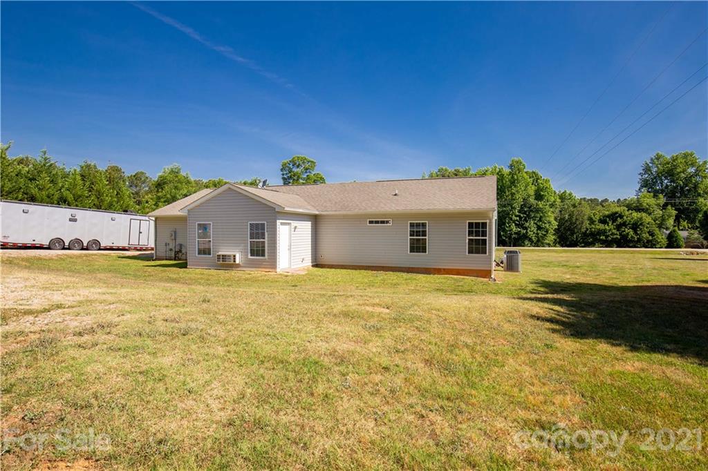 5150 Taxahaw Road Lancaster, SC 29720 - Photo 9 of 27 a front view of a house with a yard