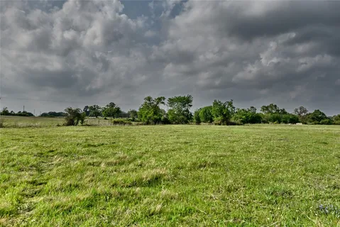 an aerial view of a houses with outdoor space