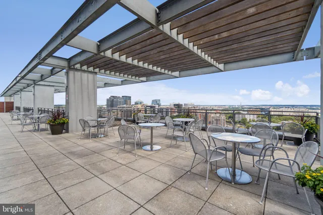 a view of a dinning table and chairs in the patio