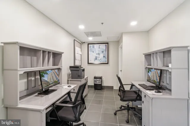 a view of a workspace with furniture and a workspace