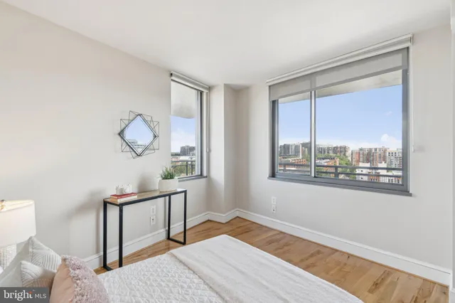 a bedroom with bed and a window