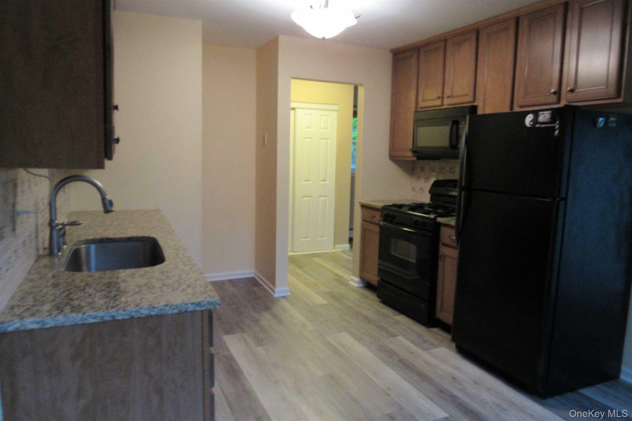 34 Alpine Drive, Unit A Wappingers Falls, NY 12590 - Photo 4 of 20 a kitchen with a refrigerator stove and sink