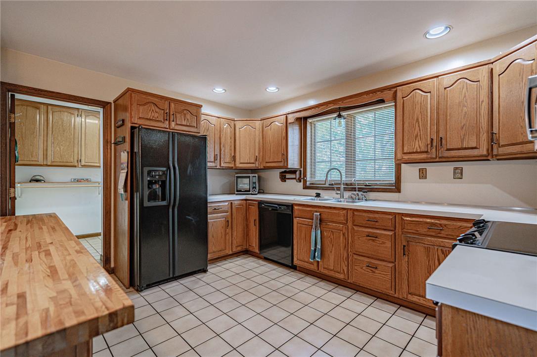 652 Old State Road Oley, PA 19547 - Photo 15 of 54 A functional kitchen features wood cabinetry and ample countertop space.