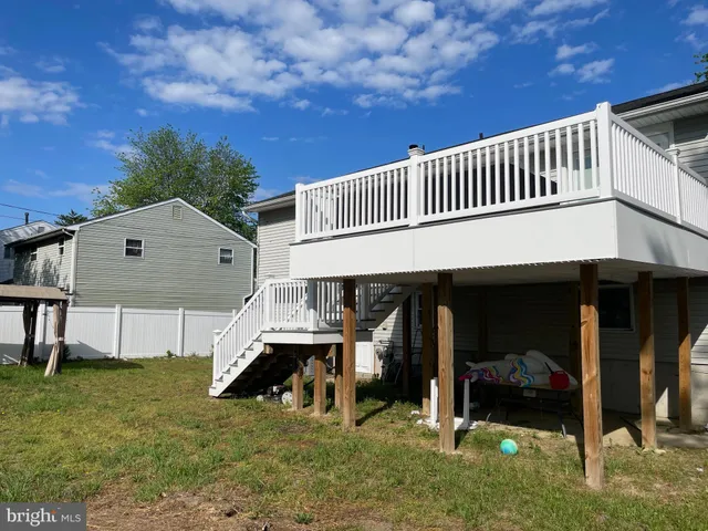 a view of a house with a porch and furniture