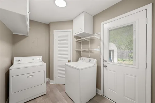 a utility room with dryer and washer