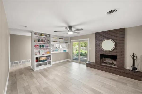 a view of a livingroom with furniture and a fireplace