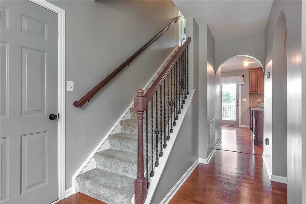 503 Walnut Drive McKees Rocks, PA 15136 - Photo 2 of 25 Beautiful foyer highlighted with hard-wood flooring and custom wrought-iron railing.