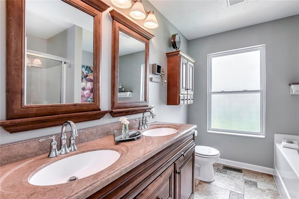 503 Walnut Drive McKees Rocks, PA 15136 - Photo 13 of 25 The master bath is a place to relax after a long day. Double vanity, soaking tub, walk- in glass enclosed shower, and ceramic tile.