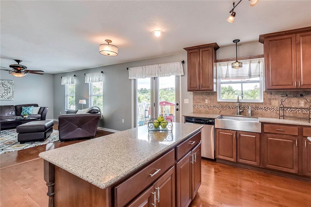 503 Walnut Drive McKees Rocks, PA 15136 - Photo 6 of 25 Natural light galore; from the picturesque windows to the upgraded light fixtures!!! Hardwood floors flow right from the kitchen into the family room.