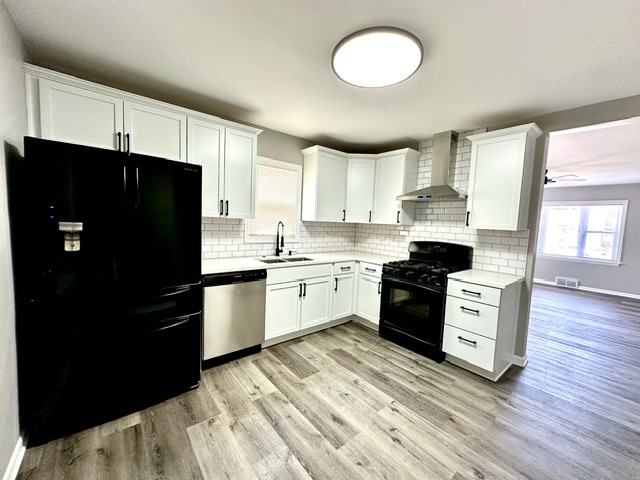 513 Cookane Avenue Elgin, IL 60120 - Photo 4 of 26 a kitchen with a refrigerator and a stove top oven