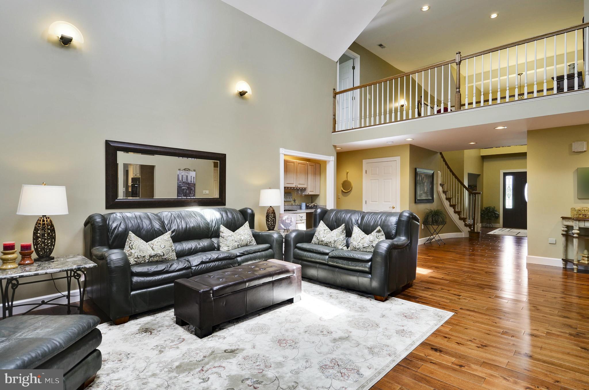 5006 South Renn Court Frederick, MD 21703 - Photo 5 of 30 a living room with furniture or couch and a wooden floor