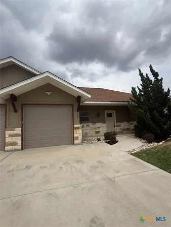 a front view of a house with yard