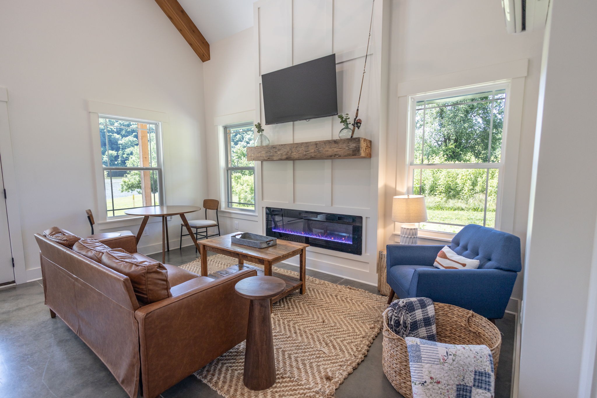 571 Bedford Lake Road Normandy, TN 37360 - Photo 22 of 96 a living room with furniture a flat screen tv and a fireplace