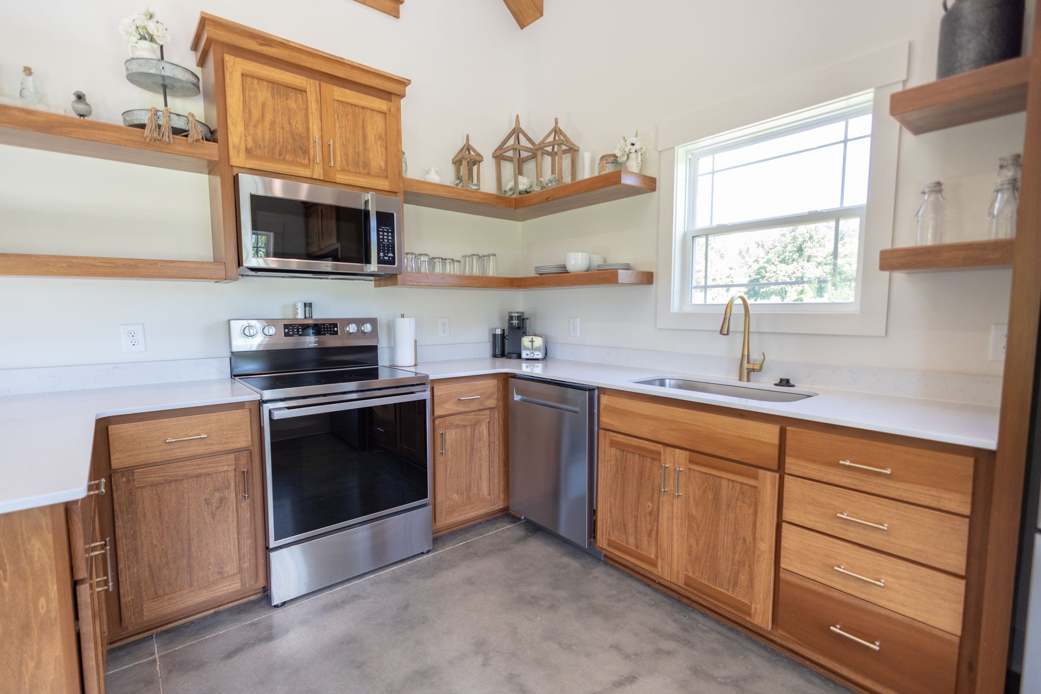 571 Bedford Lake Road Normandy, TN 37360 - Photo 24 of 96 a kitchen with stainless steel appliances a sink stove and microwave