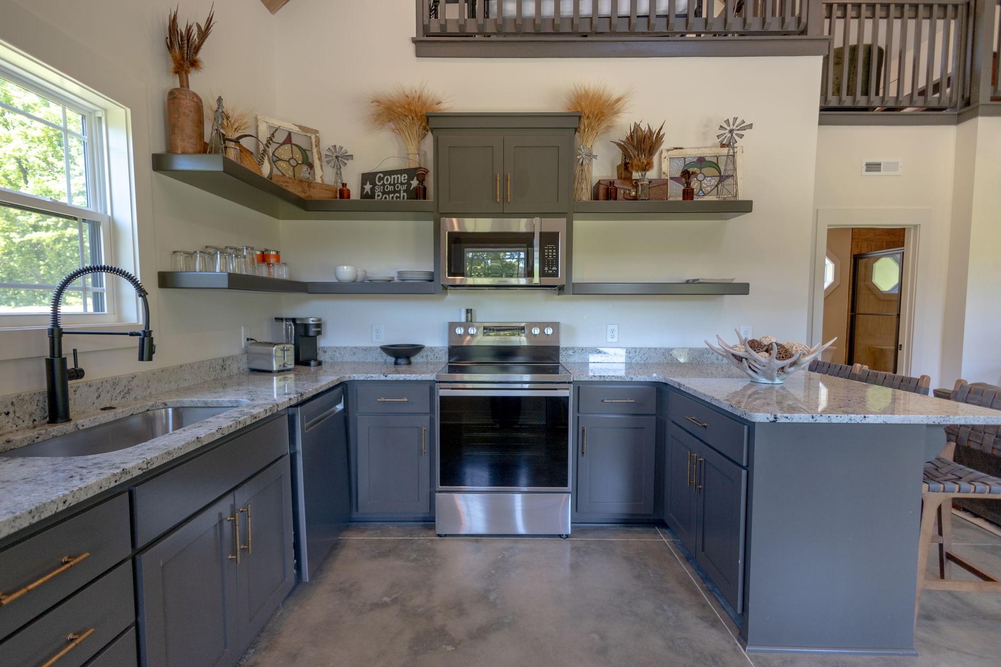 571 Bedford Lake Road Normandy, TN 37360 - Photo 50 of 96 a kitchen with stainless steel appliances granite countertop a sink stove and cabinets