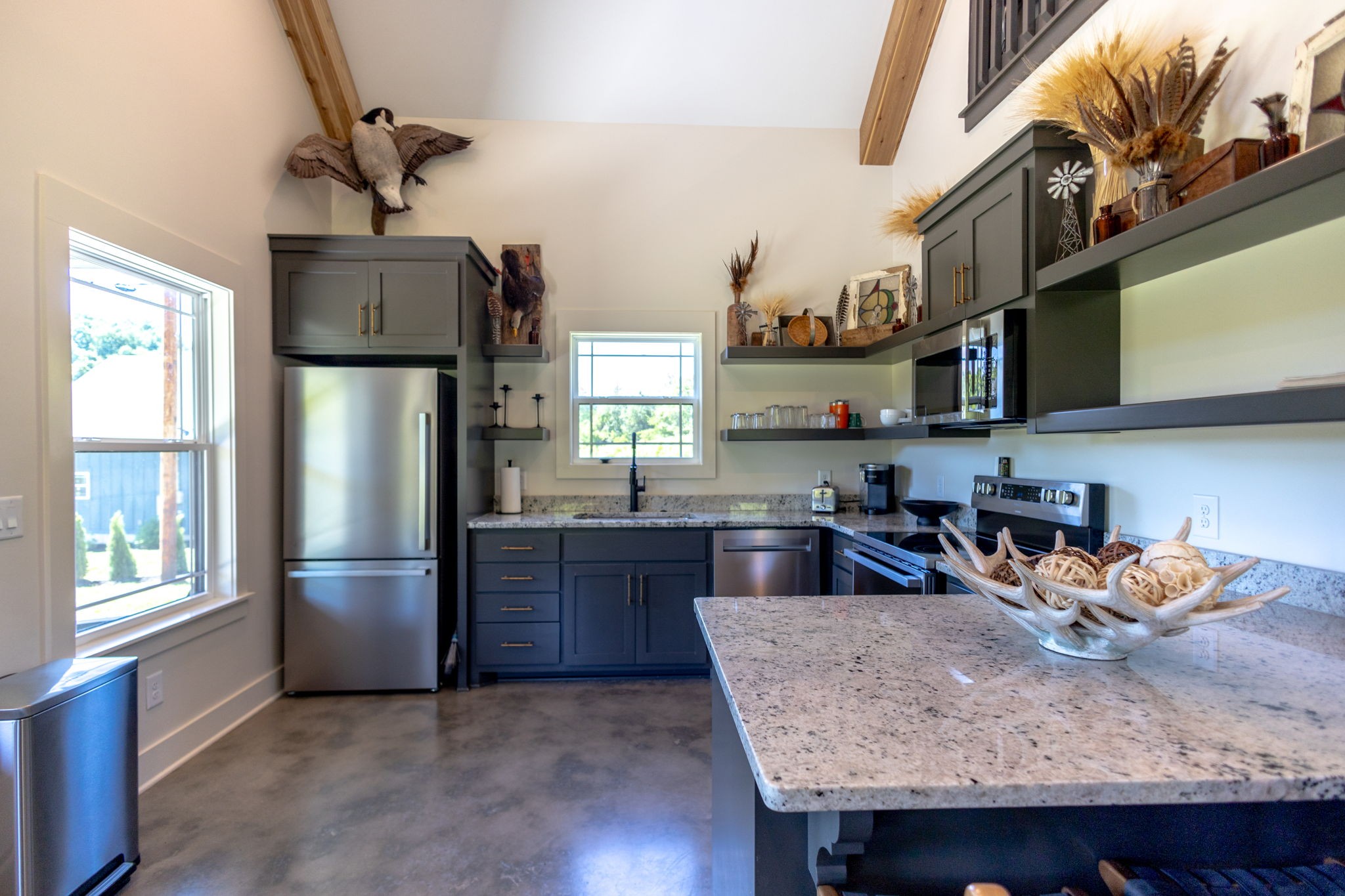 571 Bedford Lake Road Normandy, TN 37360 - Photo 51 of 96 a kitchen with stainless steel appliances granite countertop a refrigerator a sink dishwasher a stove and a refrigerator with wooden floor