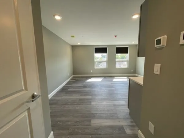 a view of room with window and hardwood