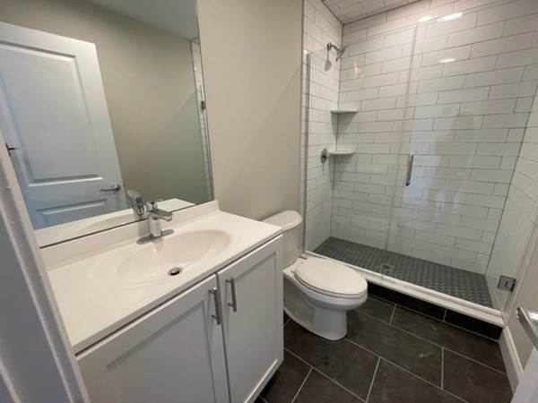 180 Shirley Avenue, Unit 210 Revere, MA 02151 - Photo 10 of 10 a bathroom with a sink a toilet and shower