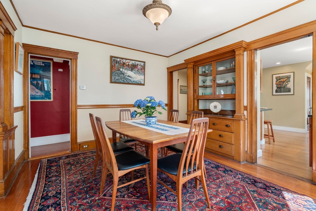 45 Springfield Street, Unit 1 Belmont, MA 02478 - Photo 8 of 27 a view of a dining room with furniture and wooden floor