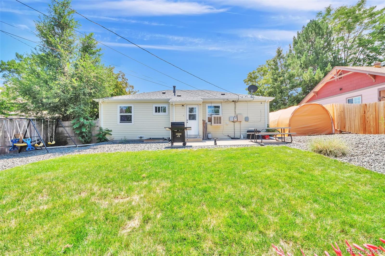 1781 Rowena Street Thornton, CO 80229 - Photo 20 of 21 a view of backyard with seating area and green space