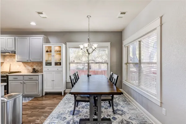 a view of a dining room with furniture window and outside view