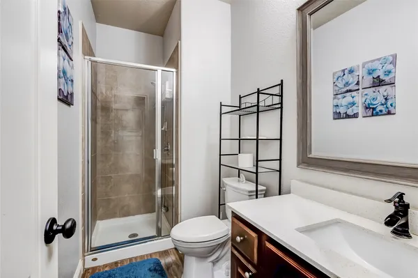 a bathroom with a sink toilet and shower