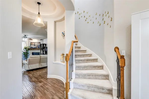 a view of a living room with furniture and a chandelier