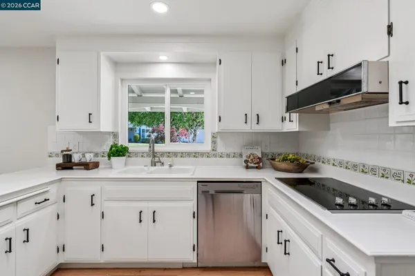 a kitchen with a table and chairs in it