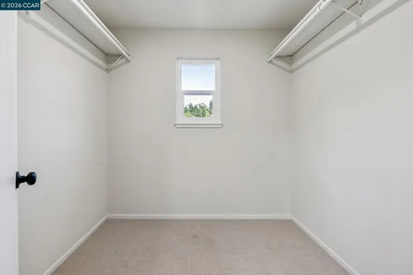 a en suite bathroom with a granite countertop sink and a mirror