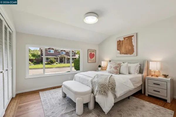 a front view of house with a garden and patio