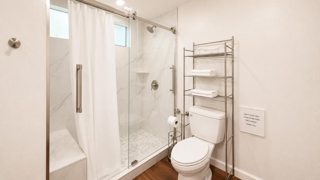 1281 Traynor Road Concord, CA 94520 - Photo 26 of 41 a white toilet sitting next to a bathroom sink