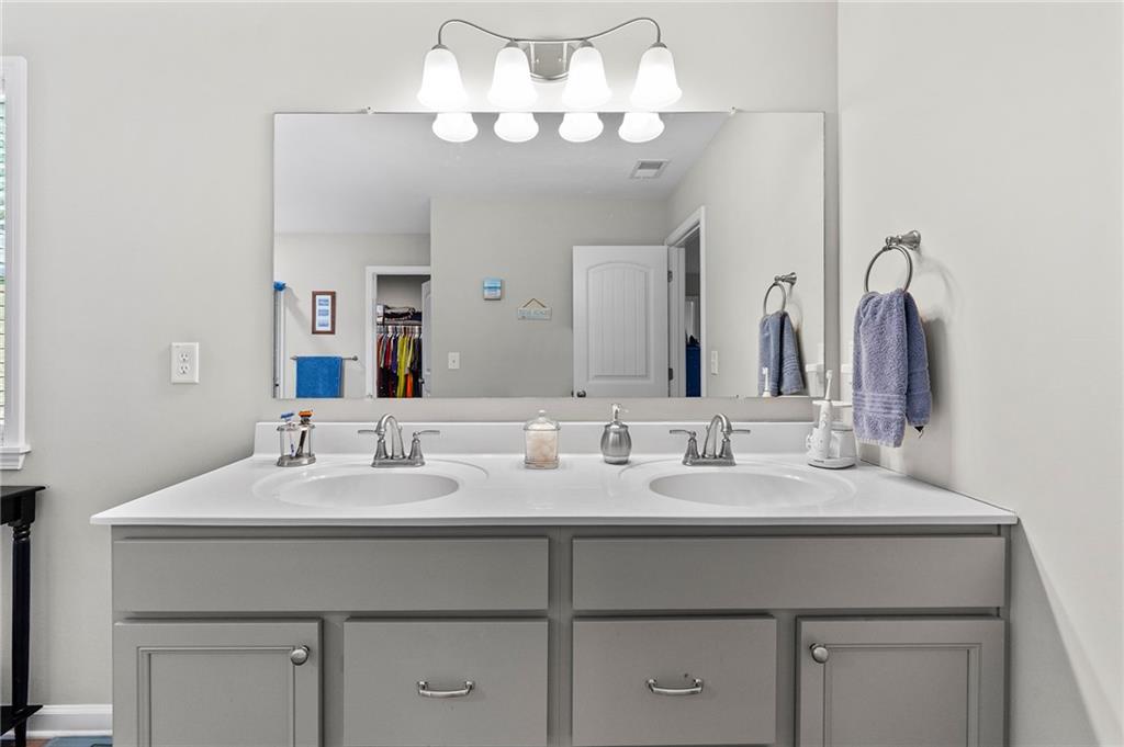 230 Augusta Walk Canton, GA 30114 - Photo 32 of 56 a bathroom with a sink vanity and a mirror