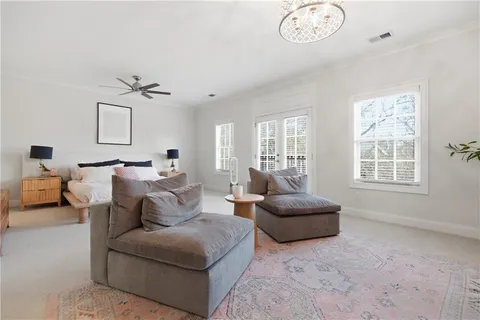 a bedroom with a bed and a television