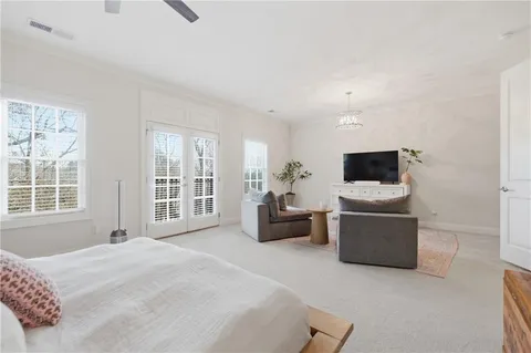 a bedroom with bed and window