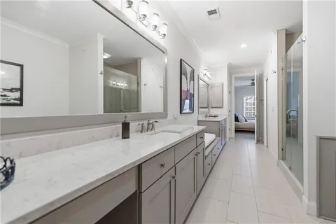 a white bath tub sitting next to a bathroom