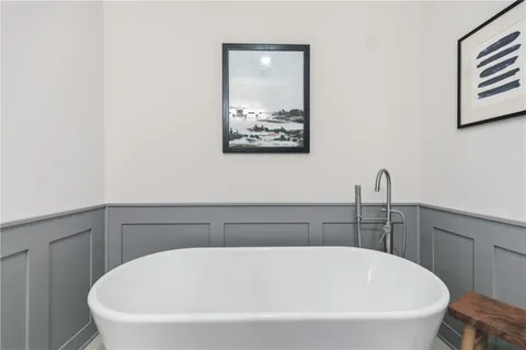 a bathroom with a sink toilet and a mirror