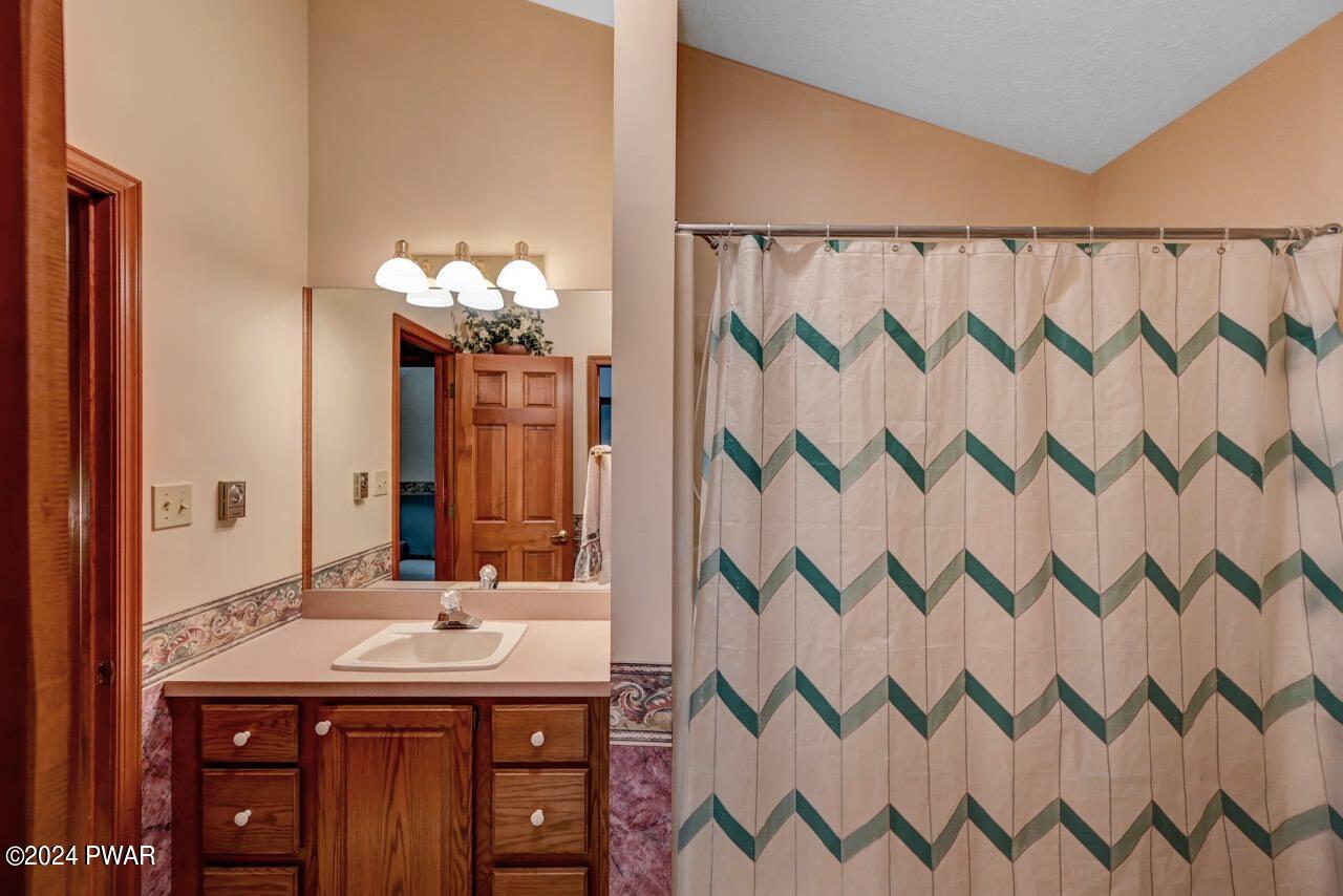 110 Valley Run Road Greentown, PA 18426 - Photo 49 of 67 a bathroom with a sink and a mirror
