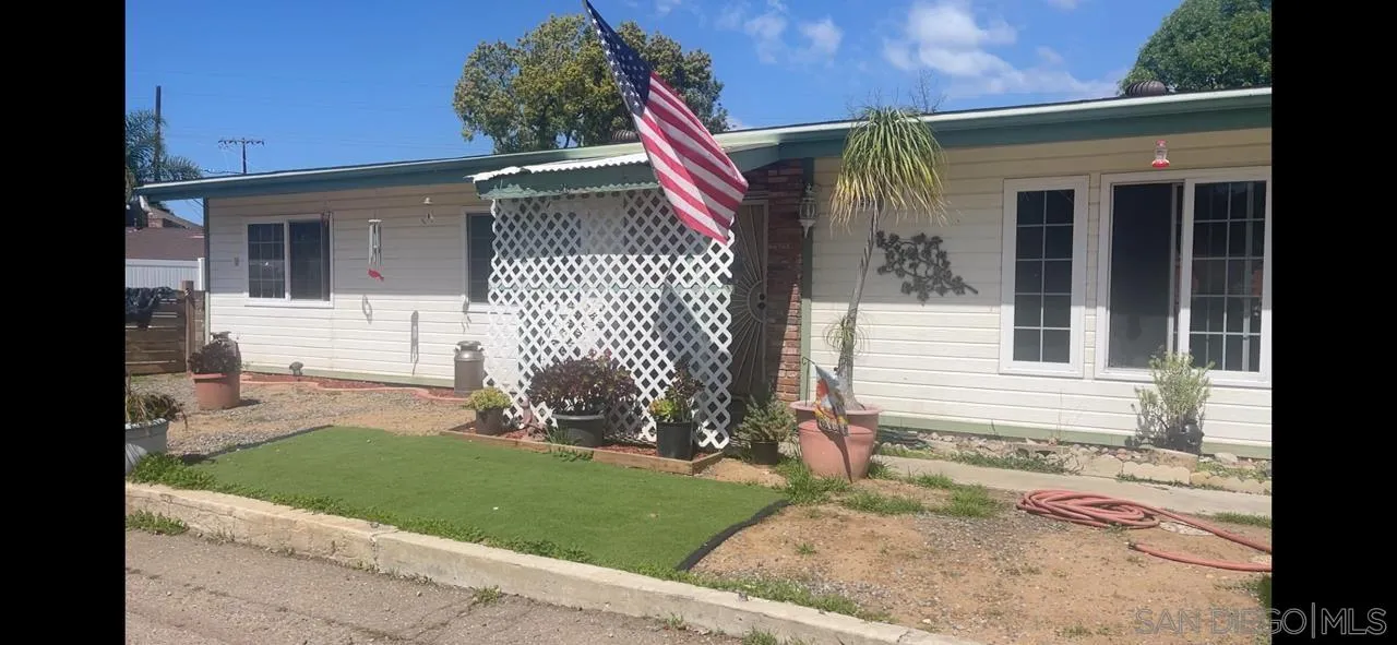 12378 Wade Way El Cajon, CA 92021 - Photo 2 of 13 a view of a house with a yard