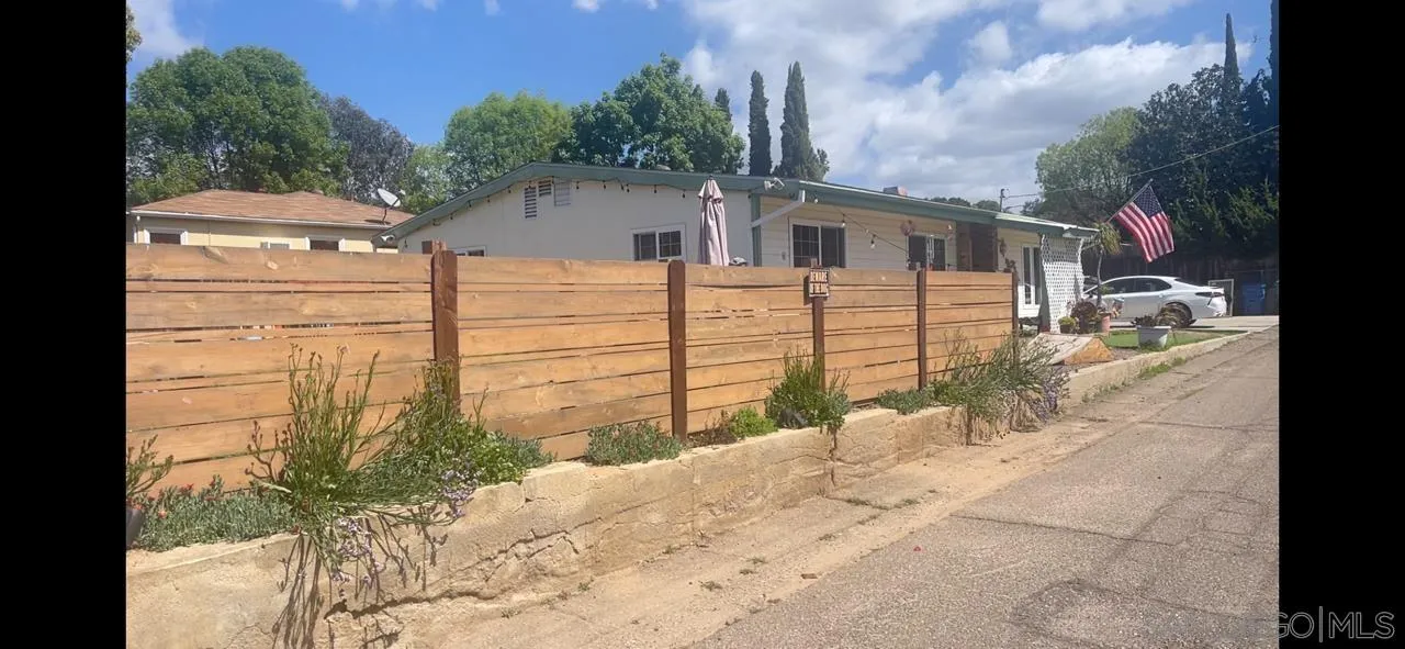 12378 Wade Way El Cajon, CA 92021 - Photo 3 of 13 a white house that has tree in front of it