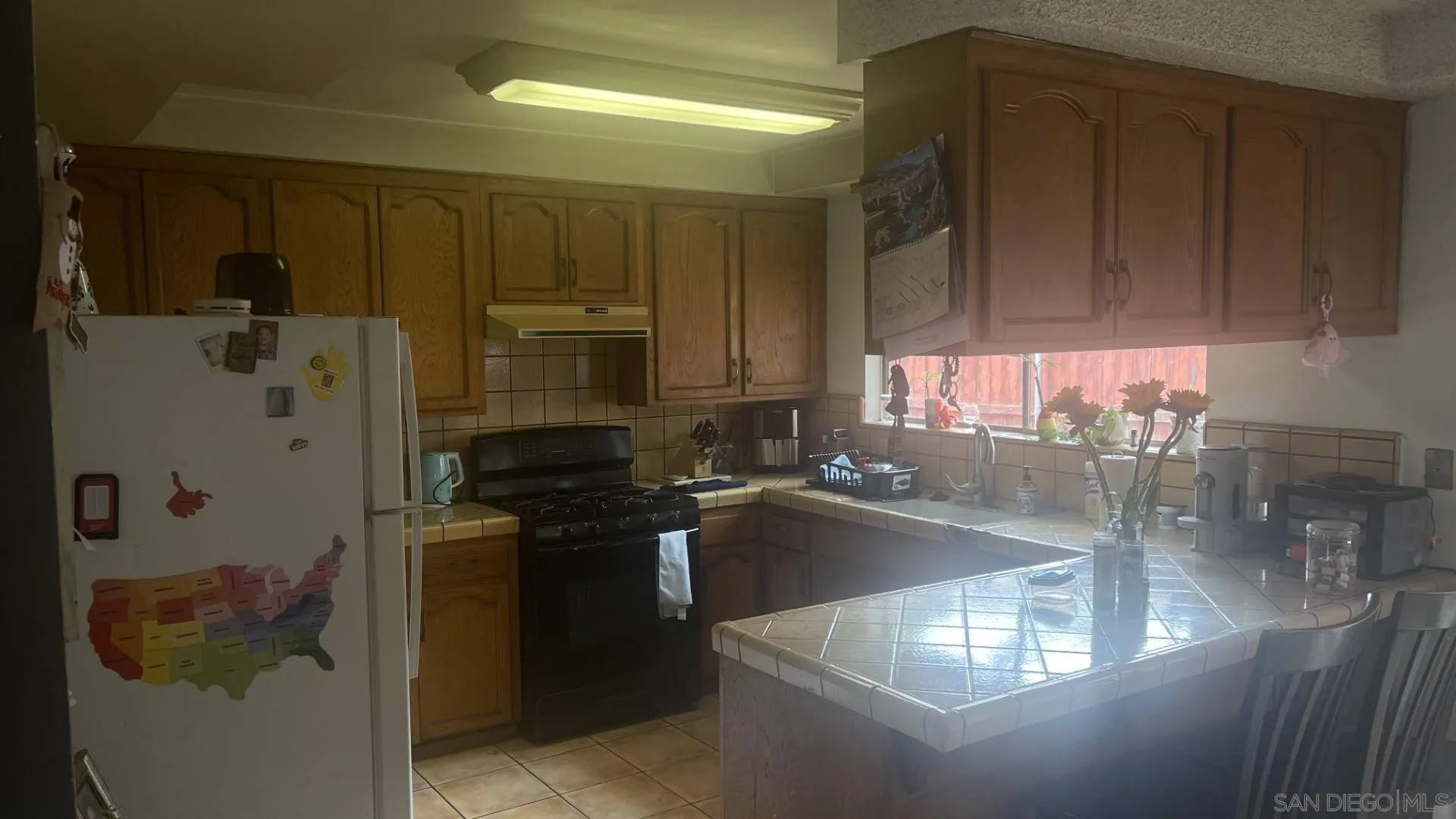12378 Wade Way El Cajon, CA 92021 - Photo 5 of 13 a kitchen with a sink and cabinets