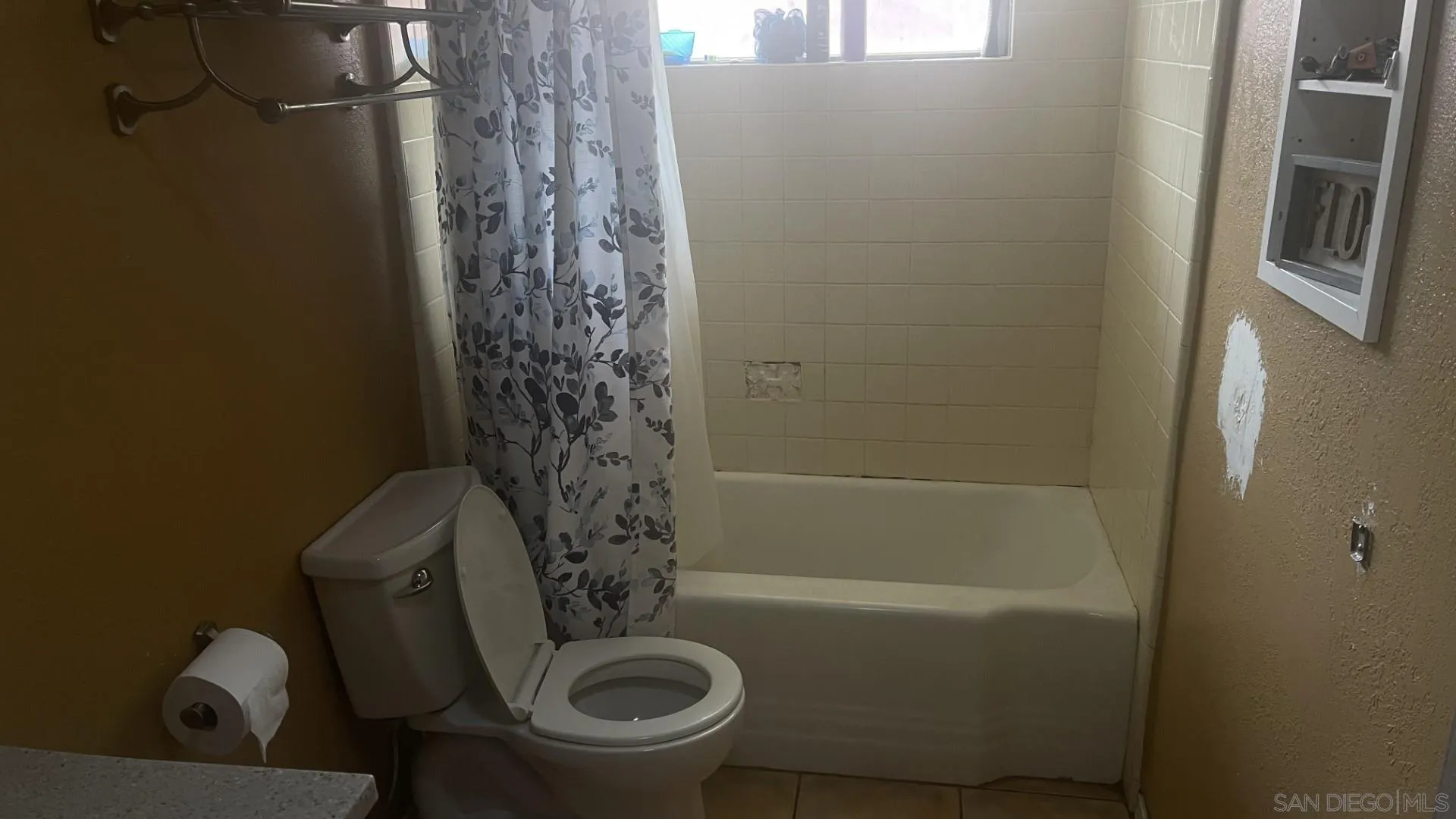 12378 Wade Way El Cajon, CA 92021 - Photo 10 of 13 a bathroom with a sink a toilet and shower