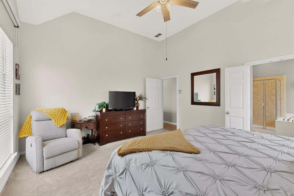 4004 White Porch Road Plano, TX 75024 - Photo 22 of 40 a bedroom with a bed and a couch
