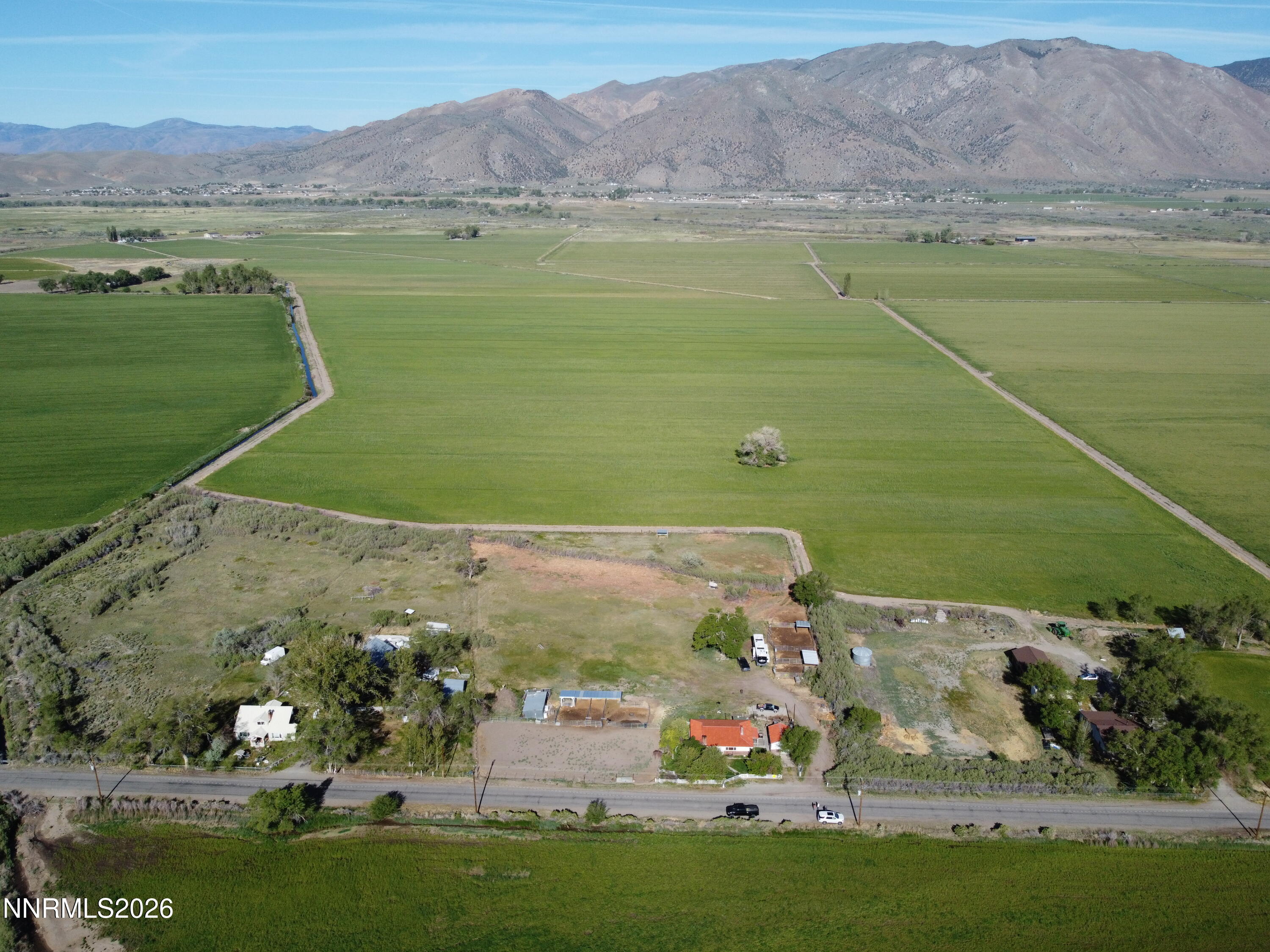 an aerial view of a mountain with a lake view