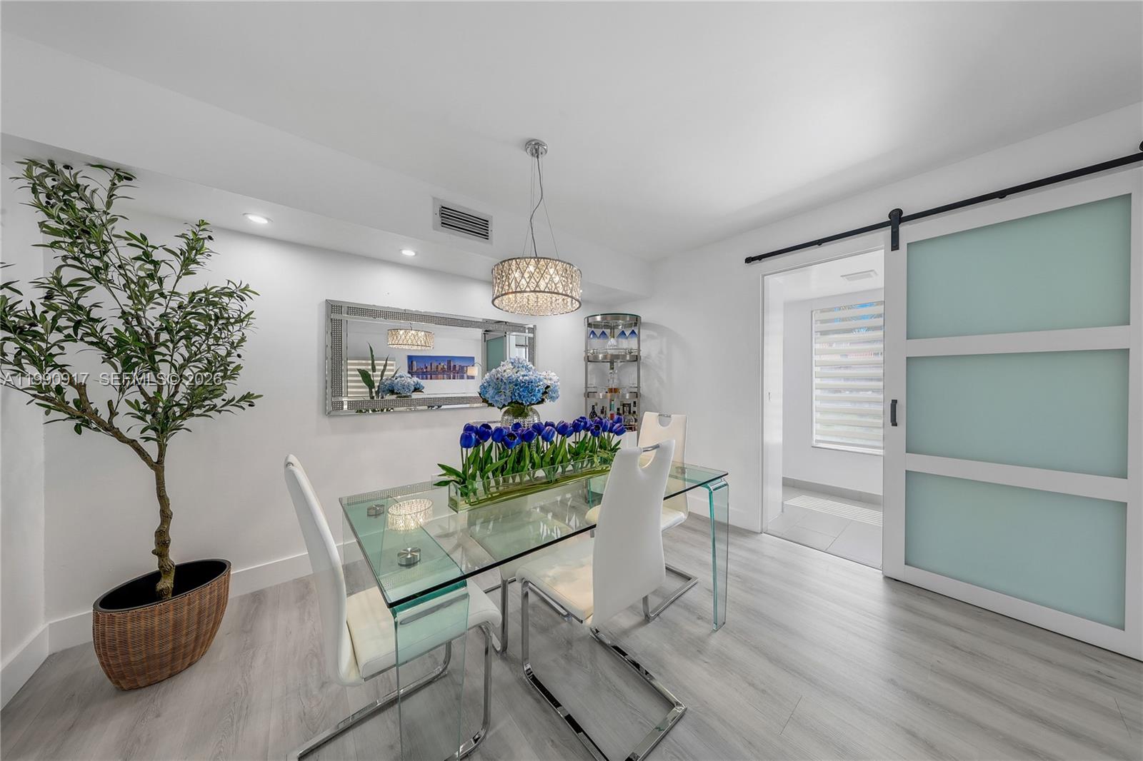 12511 Southwest 12th Lane Miami, FL 33184 - Photo 5 of 20 a view of a dining room with furniture and wooden floor