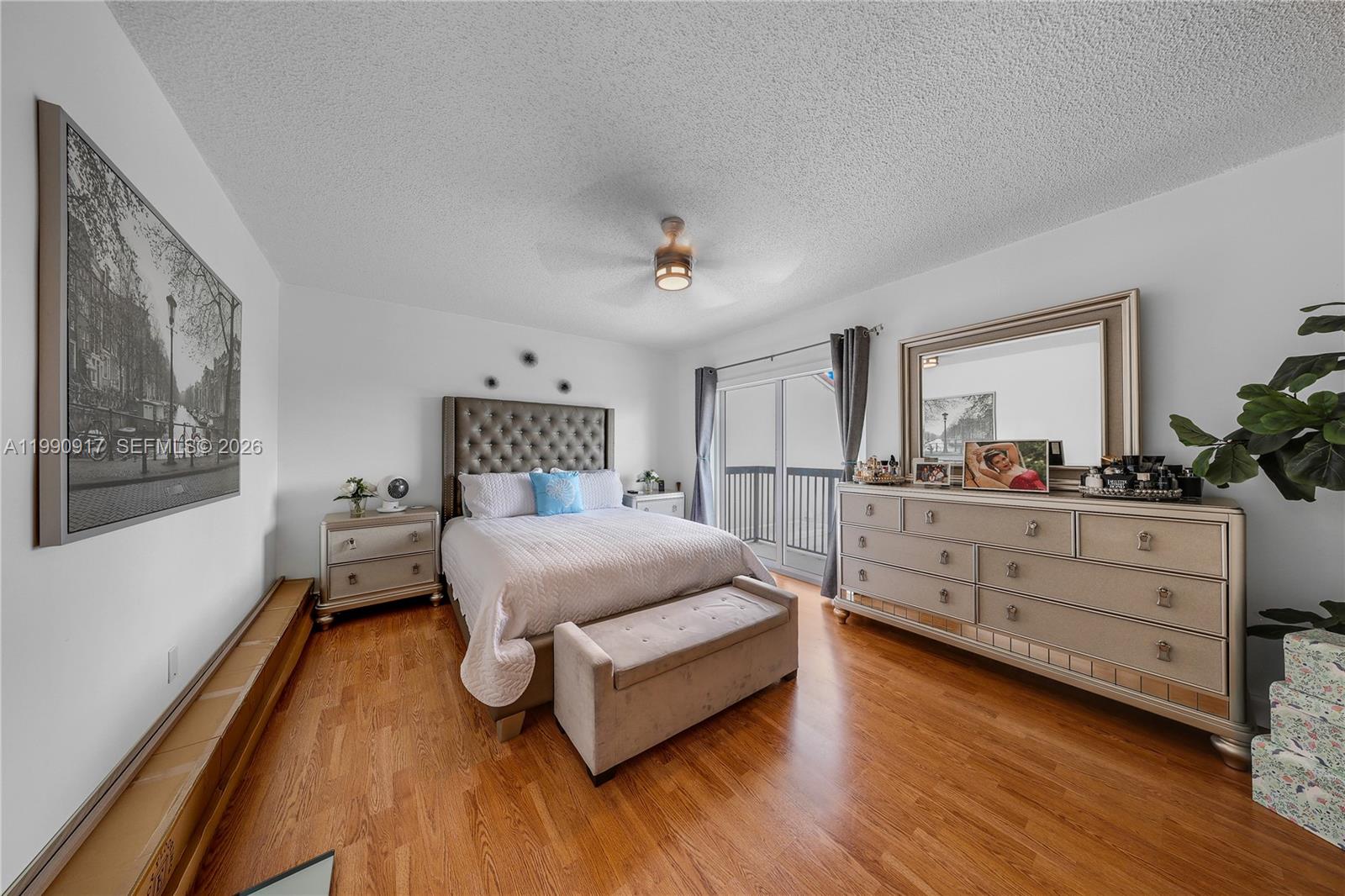 12511 Southwest 12th Lane Miami, FL 33184 - Photo 9 of 20 a spacious bedroom with a bed and a dresser